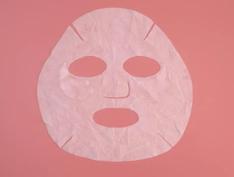 Sheet mask on a pink background Stock Photos