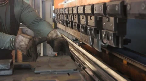Sheet of metal and hands of worker who works on press Vídeo Stock 64232717