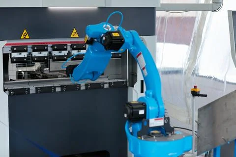 Sheet metal bending machine and industrial robot Stock Photos