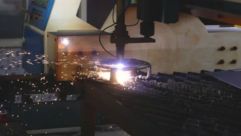 Sheet metal cutting machine cutting metal plate and sparks coming out Stock Footage 168168867