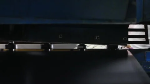 Sheet metal cutting machine in operation, side view Stock Footage 317253546