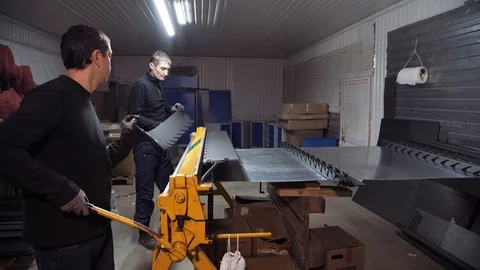 Sheet metal is placed in the machine and bend Stock Footage 108648711