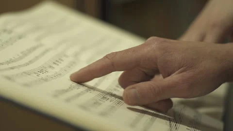 Sheet music finger pointing Stock Footage 260335030