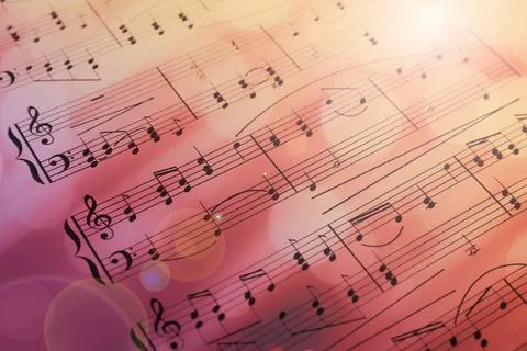 Sheet with music notes as background, closeup. Bokeh and color tone effects Stock Photos