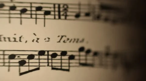 Sheet music rolling dynamic light shallow depth of field Stock Footage 59676513