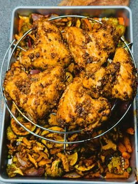 Sheet Pan Dinner with Roasted Chicken Wings and Mixed Vegetables Stock Photos