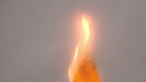 A sheet of paper bursting into flames in slow motion Stock Footage 211885532