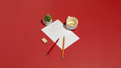 A sheet of paper for business notes or planning on a red table Stock Footage 220601053