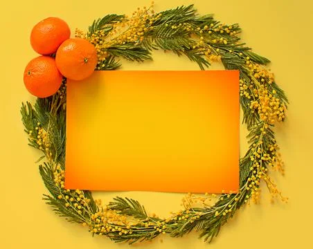 A sheet of paper on a circle of non-focal mimosa flowers with text in the m.. Stock Photos