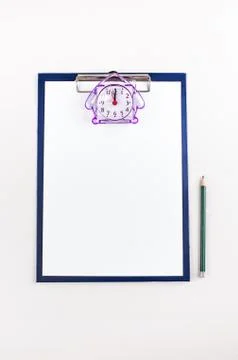The sheet of paper, a folder with clip and pencil. View from above. Stock Photos
