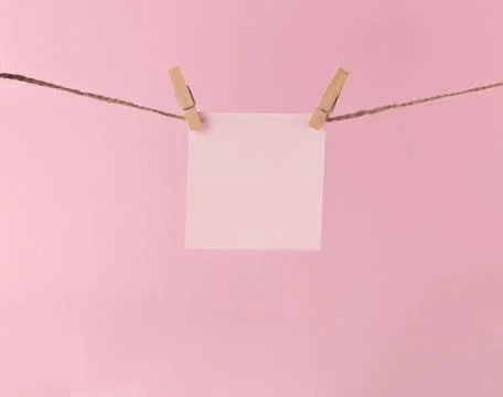 Sheet of paper for notes on hanging clothespins Stock Photos