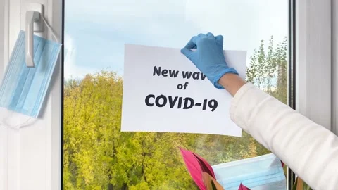 Sheet of paper with word New wave of covid-19 Stock Footage 162248498