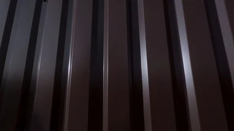 A sheet of thin bent in the form of vertical strips of metal Stock Footage 124738450