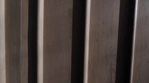 A sheet of thin bent in the form of vertical strips of metal Stock Footage 124762058