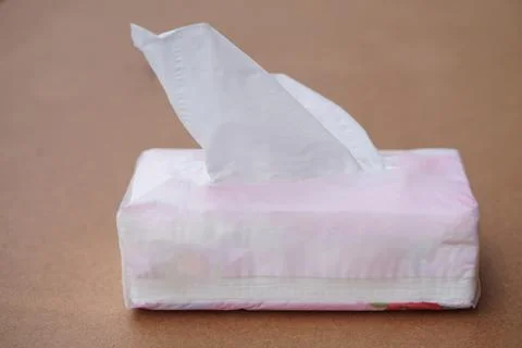Sheet tissue paper package, on brown background.  Concept, item for cleaning, wi Stock Photos