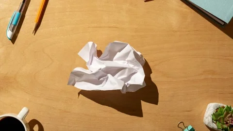 A sheet of white crumpled paper on the table. stock video Stock Footage 220601227