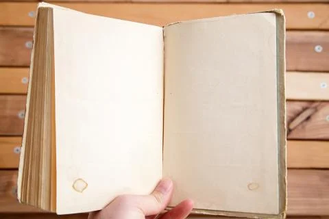 Sheets of book with empty space on wooden background Stock Photos