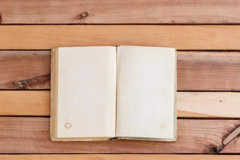 Sheets of book with empty space on wooden background Stock Photos