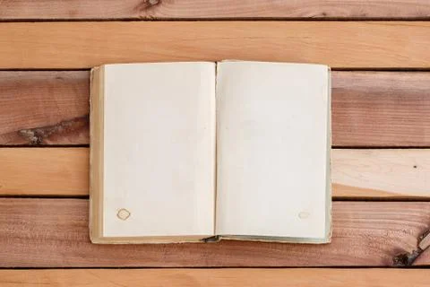 Sheets of book with empty space on wooden background Stock Photos
