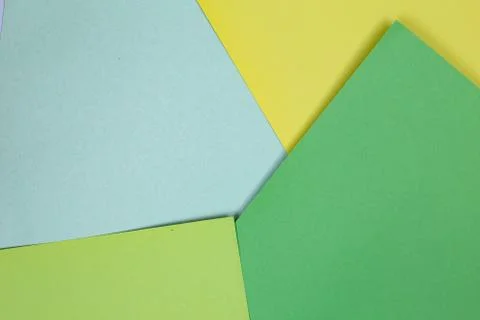 Sheets of colored paper. Many colored sheets of paper are laid out in the har Stock Photos