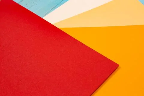 Sheets of colored paper. Many colored sheets of paper are laid out in the har Stock Photos