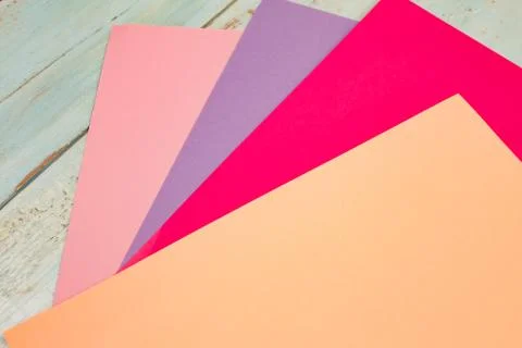 Sheets of colored paper. Many colored sheets of paper are laid out in the har Stock Photos