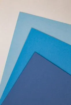 Sheets of colored paper. Many colored sheets of paper are laid out in the har Stock Photos