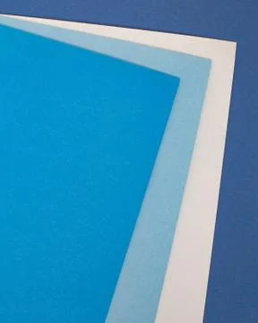 Sheets of colored paper. Many colored sheets of paper are laid out in the har Stock Photos