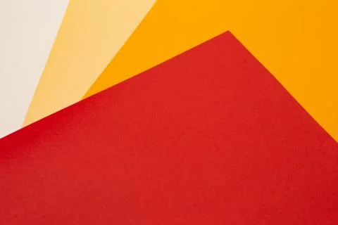 Sheets of colored paper. Many colored sheets of paper are laid out in the harsh 库存照片