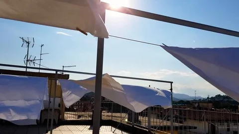 Sheets to dry on the terrace Stock Footage 92585630