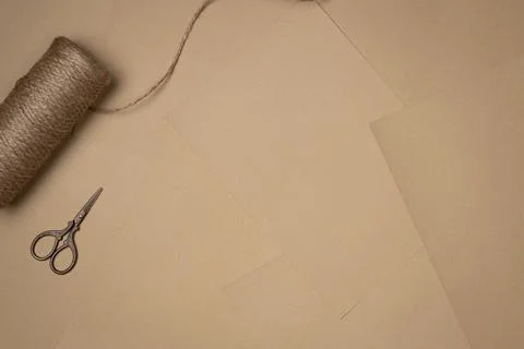 Sheets of paper background with string and scissors. Vintage. Flat lay, top.. Stock Photos