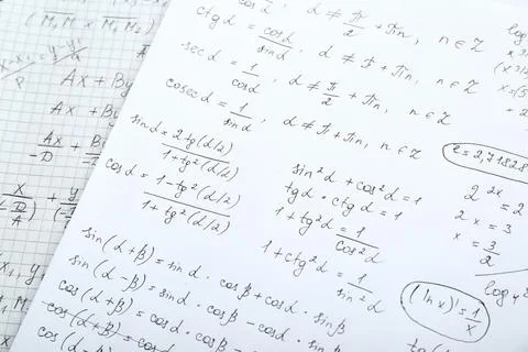 Sheets of paper with different mathematical formulas, closeup Fotos de archivo