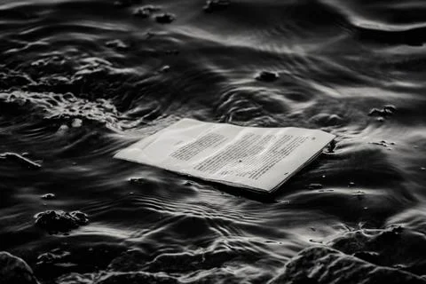 Sheets of paper floating in the river Stock Photos