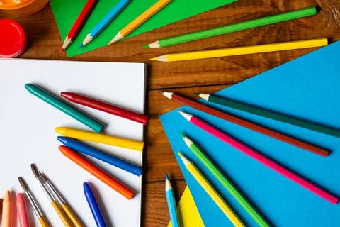 Sheets of paper, glue and scissors on a wooden table. Children's art project, Stock Photos