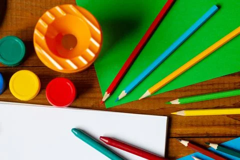 Sheets of paper, glue and scissors on a wooden table. Children's art project, Stock Photos