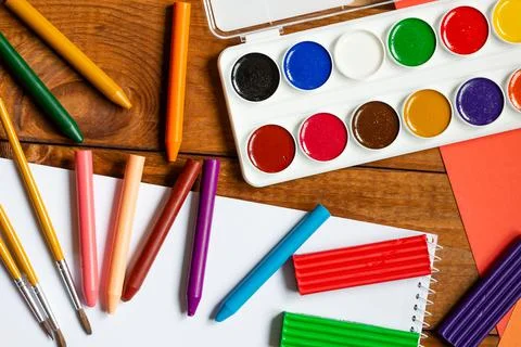 Sheets of paper, glue and scissors on a wooden table. Children's art project, Stock Photos