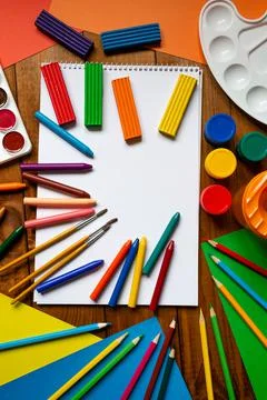 Sheets of paper, glue and scissors on a wooden table. Children's art project, Stock Photos
