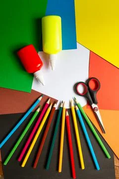 Sheets of paper, glue and scissors on a wooden table. Children's art project, Stock Photos