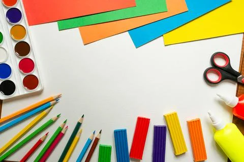 Sheets of paper, glue and scissors on a wooden table. Children's art project, Stock Photos