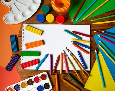 Sheets of paper, glue and scissors on a wooden table. Children's art project, a Stock Photos