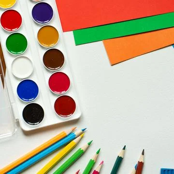 Sheets of paper, glue and scissors on a wooden table. Children's art project, a Stock Photos