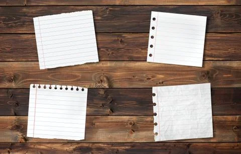 Sheets on wood background Stock Photos