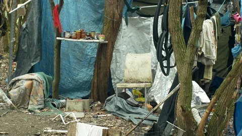Sheets wood plastic foil chalet building lair homeless, cooked food in a glass Stock Footage 102109970