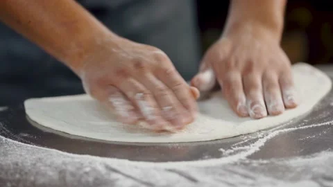Сhef in a professional kitchen prepares the dough with flour to make the bio Video stock 141203776