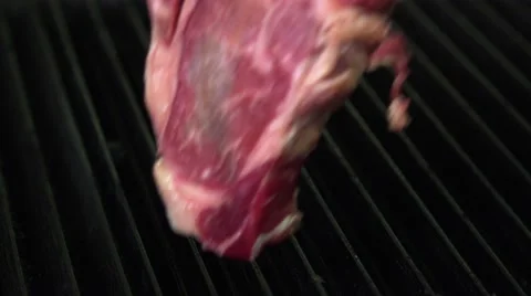 Shef put a Steak on the grill Stock Footage 66529579