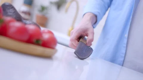 Сhef is taking the leather case and pulls out the knife Stock Footage 134232065