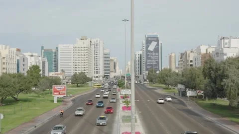 Sheikh Zayed Bin Sultan Street in Abu Dhabi with corporate buildings and cars Stock Footage 331342929