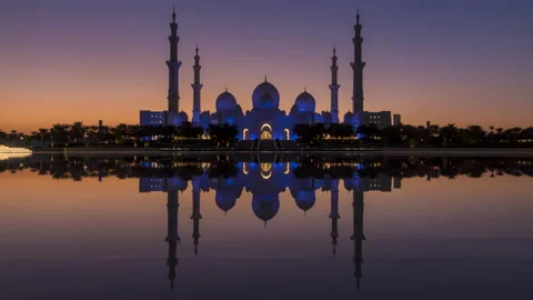Sheikh Zayed Grand Mosque mirror reflection day to night time lapse Stock Footage 169274438