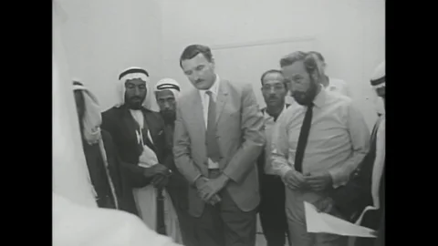Sheikh Zayed looks over scale models of proposed building plans in Abu Dhabi in Vídeos de archivo 143858175