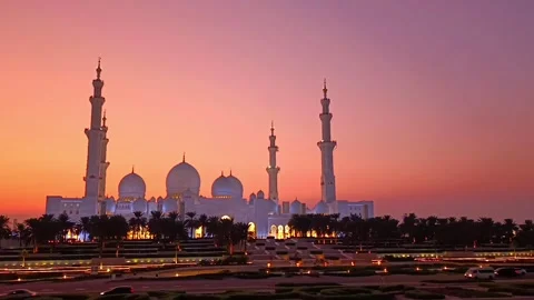 Sheikh Zayed Mosque at sunset against the orange and pink sky Stock Footage 324857580
